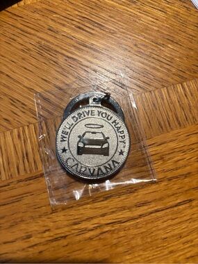 Carvana Silver Toned Keychain Medallion - We'll Drive You Happy (unopened)